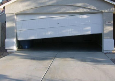 garage door off track repair in in San Fernando